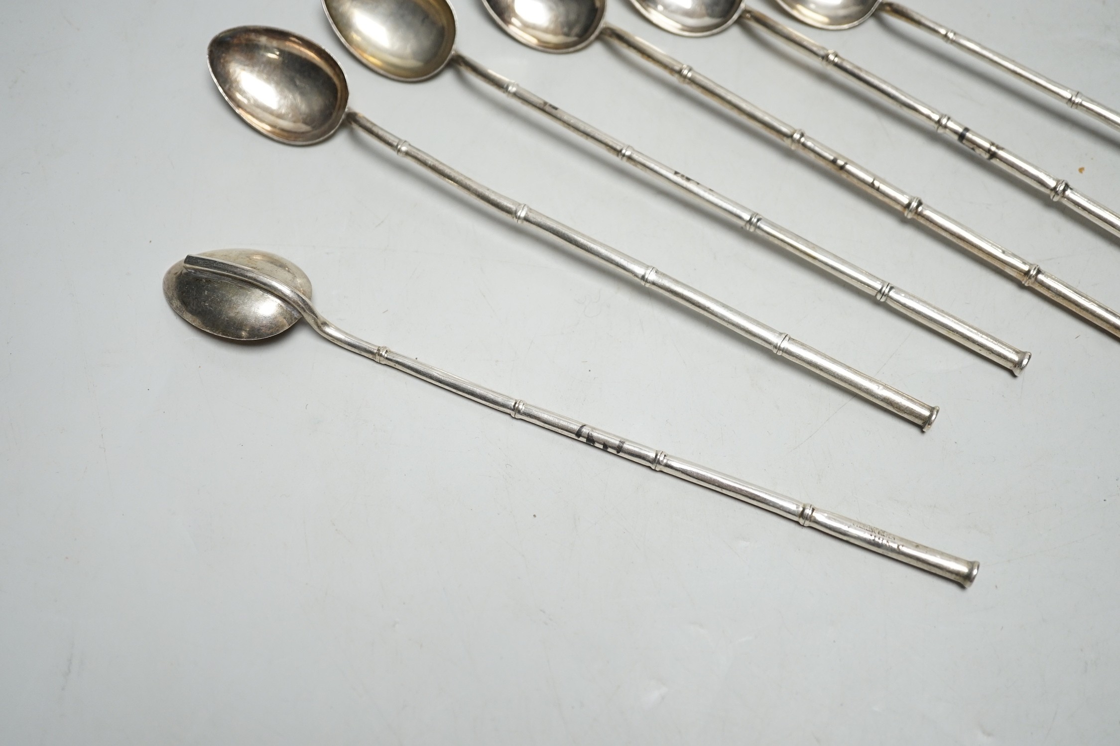 A set of six Chinese sterling cocktail straw spoons, 19.4 cm.